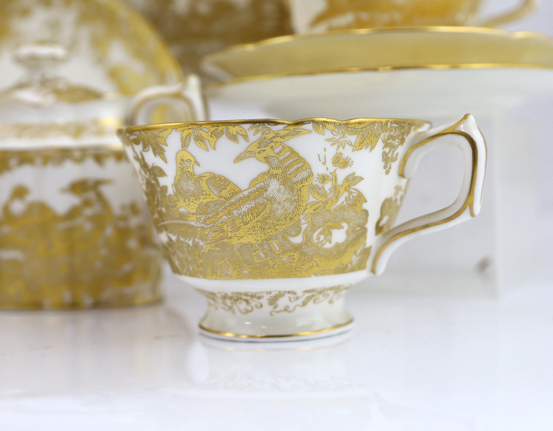 An extensive Royal Crown Derby Gold Aves dinner and tea service